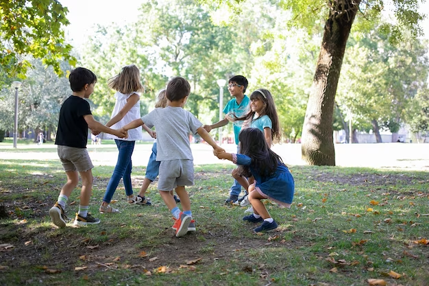 A group of 7 kids playing as a part of holistic education system, which energizes the body leading to active mental and physical participation in everyday activities. 